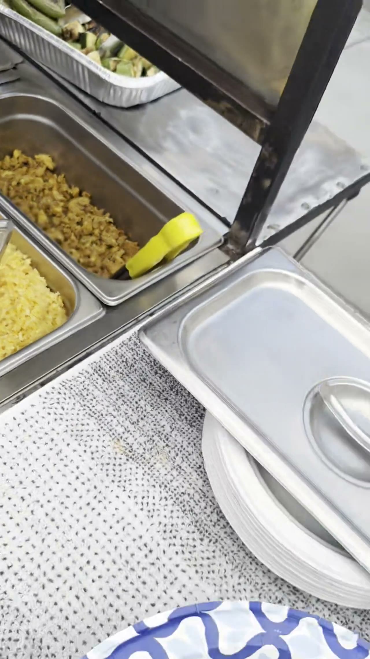 Trays of seasoned chicken and yellow rice